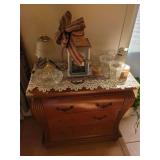 Three-Drawer Wood Dresser with Household Items