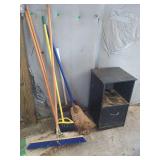 Variety of Brooms and Side Table