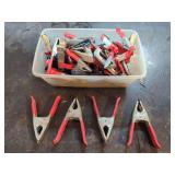 Assorted Metal and Plastic Spring Clamps in Storage Bin