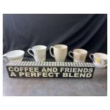 Assortment of Coffee Mugs and Coffee Sign