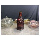 Vintage purple glass 'McGiver's American Army Bitters' bottle and other Glass ware