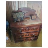 Three-Drawer Wooden Chest with Decorative Boxes and Linens