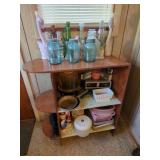 Wooden Shelving Unit with Assorted Household Items and Glassware