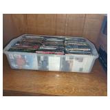 Assorted DVD and Blu-ray Films in Storage Bin