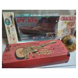 Toy and Model Collection: Lindberg PT-109, Mattel Strum-Fun Getar, Ken Doll Box, and Cracked Magazine