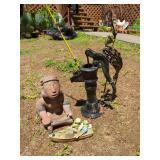 Garden Decor Assortment: Cast Iron Pump, Metal Crane, Ceramic Figure, and Frog Boat