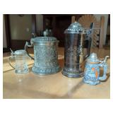 Four Decorative Lidded Steins