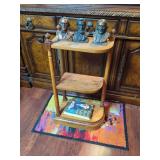 Three Banthrico Metal Bust Banks and Wooden Tiered Stand