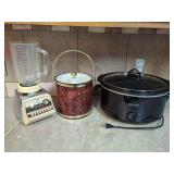 Kitchen Appliance Assortment: Osterizer Blender, Ice Bucket, and Crock-Pot Slow Cooker