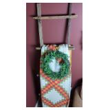 Rustic Wooden Ladder with Quilt and Decorative Wreath
