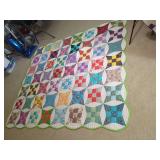 Multi-Pattern Patchwork Quilt with Scalloped Border and Hand Stitching