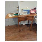 Singer Model 604 Slant Needle Auto-Reel Sewing Machine in Wooden Cabinet with Accessories