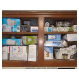 Household Utility Assortment of Light Bulbs, Cleaning Products, and Batteries