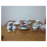 Porcelain Tea Cups, Saucers, and Creamers with Various Makers and Hand-Painted Floral Motifs