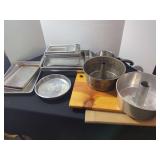 Kitchenware Assortment Including Baking Pans and Wooden Cutting Boards
