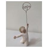 Resin Figurine Featuring Child Holding Wire Balloon with Inscribed Word Hope