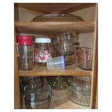 Kitchenware Assortment Including Glass Mixing Bowls, Measuring Cups, and Serving Platter