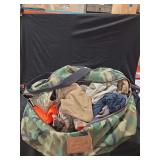 Winchester Camouflage Duffel Bag with Assorted Apparel and Accessories