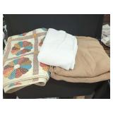 Textile Bundle Featuring Floral Dresden Plate Quilt, White Textured Blanket, and Tan Herringbone Blanket