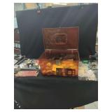 Amber Plastic Storage Box Containing Sewing Supplies, Thread Spools, Needles, and Notions
