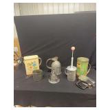 Kitchenware Assortment Including Tins, Measuring Tools, and Utensils