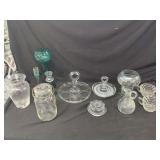 Assorted Glassware Including Candlestick Holders, Serving Trays, and Mason Jar