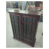 Dark Wood Cabinet with Glass Panel Doors and Interior Shelving