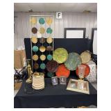 Home Decor Assortment Featuring Metal Wall Art Panels, Decorative Plates, Picture Frames, and Lighting