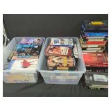 Assorted VHS Movie and Blank Tapes with Plastic Storage Bins