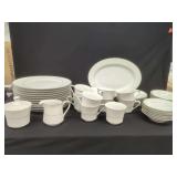 Fine Porcelain Dinnerware Set with Silver Trim and Embossed Floral Pattern
