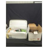 Assorted VHS Tapes and Media Storage Totes