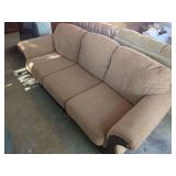 Ashley Furniture Upholstered Three-Seat Sofa with Carved Wood Trim