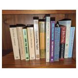 Assorted Literary Fiction Paperbacks and Woven Basket with Rolling Pin