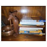 Assorted Hardcover Nonfiction Books and Decorative Wood Sculpture