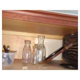 Kitchenware Assortment Including Glass Milk Bottles and Wooden Serving Boards