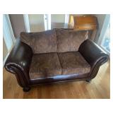 Bonded Leather and Fabric Loveseat with Rolled Arms and Paisley Cushions