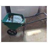 Green Plastic Broadcast Spreader with Metal Frame and Two Wheels