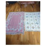 Two Woven Throw Blankets Featuring Floral and Village Motifs