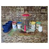 Kitchenware Assortment with Glass Dispenser, Ceramic Rooster Mugs, Fruit Glasses, and Wooden Rolling Pin