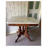 Eastlake Marble Top Parlor Table with Carved Wood Base and Casters