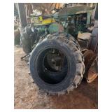 John Deere 1010 Tractor with Additional Parts and Wheels