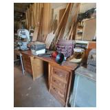 Wooden Desk with Various Workshop Tools and Accessories