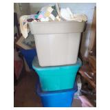 Stacked Plastic Storage Containers with Hand-Pieced Quilts and Bedding