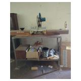 Makita Compound Miter Saw on Metal Work Bench with Accessories