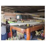 Wooden Table Loaded with Window Blinds and Hardware