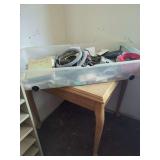Wooden Table with Plastic Storage Tub and Miscellaneous Household Contents
