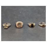 Four Sterling Silver and Yellow Gold Gemstone Rings
