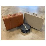 Three-Piece Luggage Set Including Two Hardside Suitcases and a Round Train Case