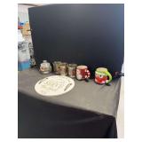 Seasonal Decor and Tableware Assortment Including Mugs, Glassware, and Decorative Signage