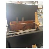 Industrial Wood Storage Box, Metal Tubes, Machete with Scabbard, and Wooden Tool